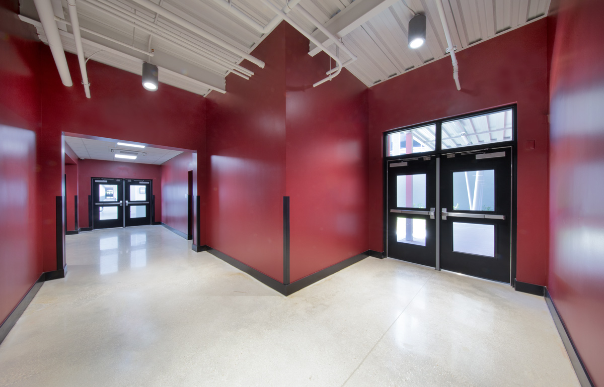 Interior design view of the classrooms corridor at the Somerset Collegiate Preparatory Academy hs in Port St Lucie, FL.